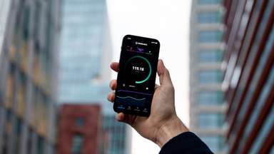 Man holding phone up to get a good connection